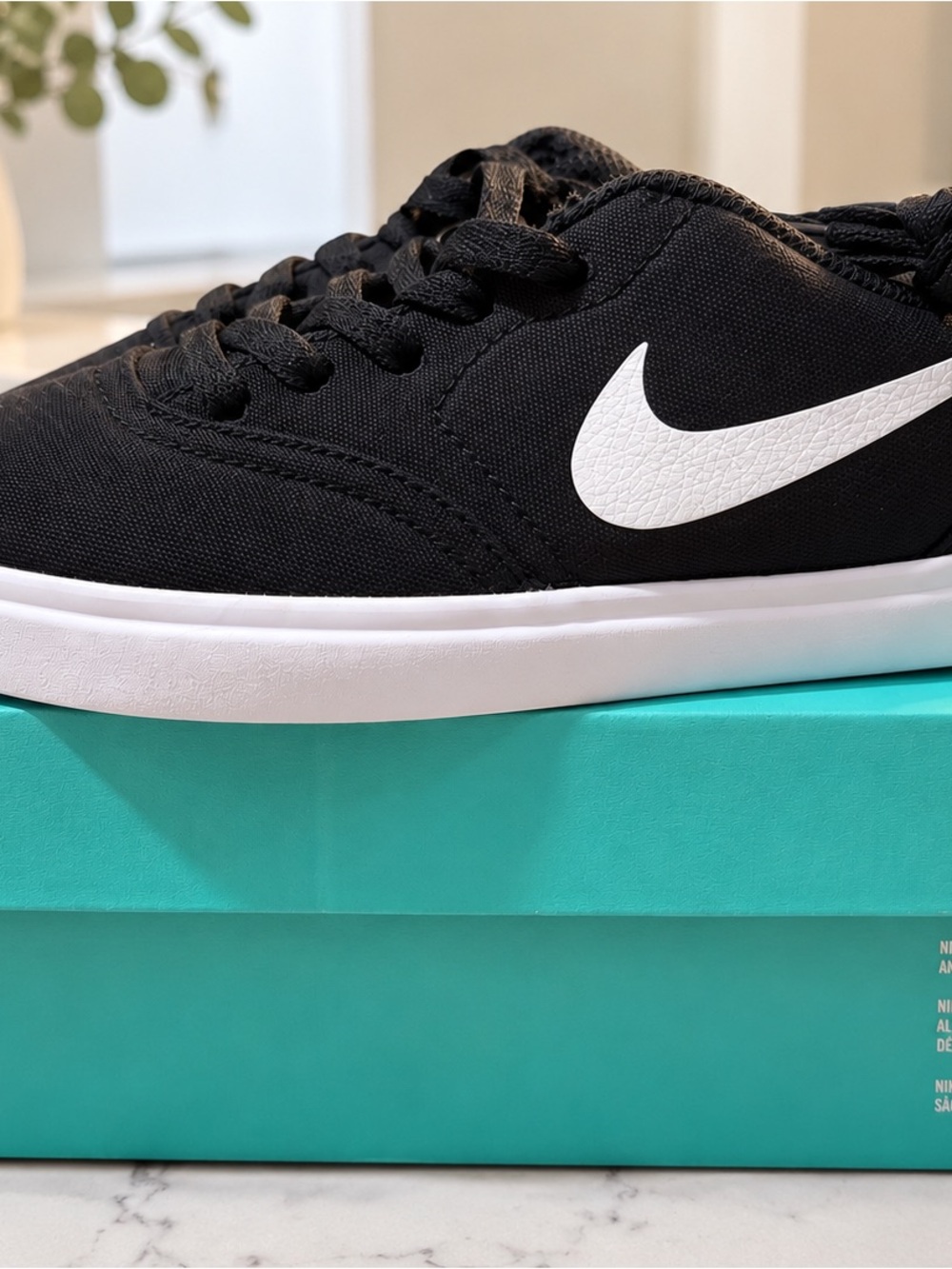 Nike Kids Black Canvas Sneaker with White Swoosh